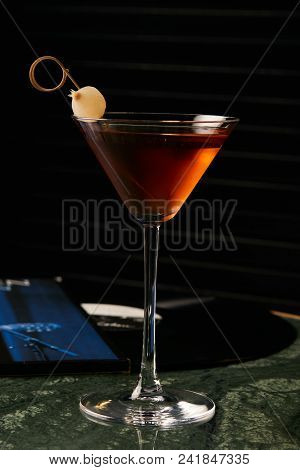 Vinyl Manhattan Cocktail On Bar Table. Freshness Alcoholic Beverage Drink With Whiskey, Rosso, Roseh