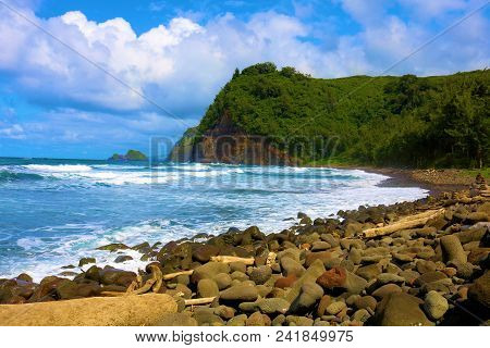 Waves Crashing Onshore To A Rural Rocky Beach Surrounded By A Lush Forest Taken At Pololu Beach In T