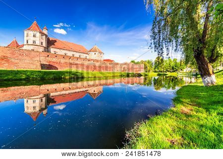 Fagaras, Romania. Spring Green Blossom Landscape With Fagaras Fortress, Transylvania.