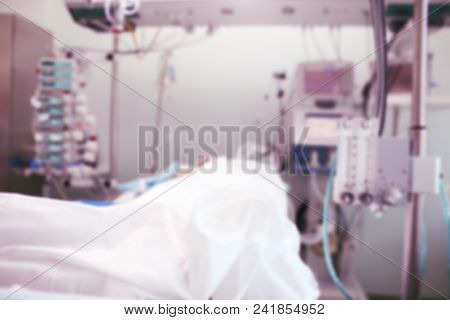Patient In The Intensive Care Unit Under 24-hour Medical Supervision, Unfocused Background.