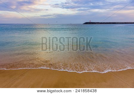 View of an empty beach in a overcast day in Sesimbra, Portugal
