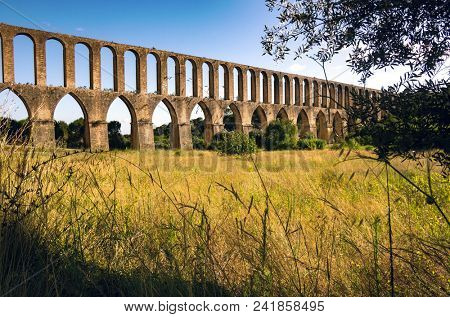 Rural landscape with ancient landmark aqueduct of Tomar region in Portugal