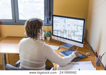 Close Up Of Ainterior Designer Working At Home. Architect Working On Computer At New House Project W