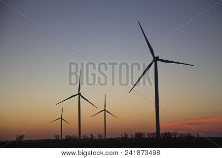 Wind Energy Turbines Field With Blue Sky, Renewable Electric Energy Source, Green Energy Nature Frie