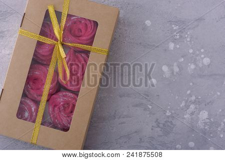 Sweet Meringues In Gift Box. Top View On Gray Background