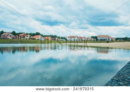 Green Public Park With Pond Meadow Grass Field Blue Sky For Leisure Landscape