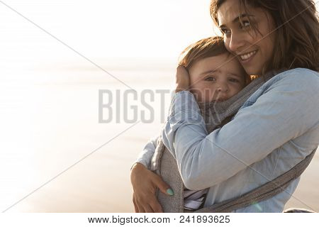Mother Carrying Baby