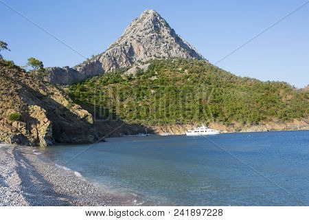 Beach In Adrasan Bay, High Rocky Hill At Back, Lycia, Province Of Antalya, Turkey, Resort Beach