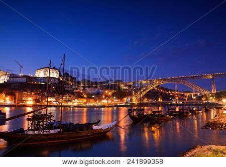 Porto, Old Town Skyline With The Douro River And Rabelo Boats. Is The Second Largest City In Portuga