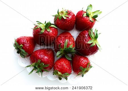 Strawberry Scattered On A White Background Isolate.
