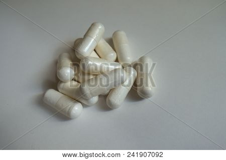 Group Of White Capsules Of Magnesium Citrate