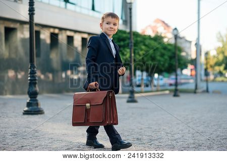 Concept Future Businessman. Business Meeting. Side View Of Walking Businessman In Formal Wear Walkin
