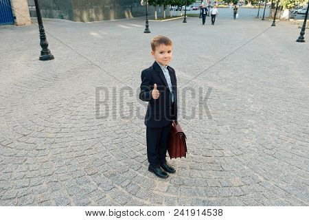 Concept Future Businessman. High Angle Of Businessman In Formal Wear Standing On Pedestrian Street C