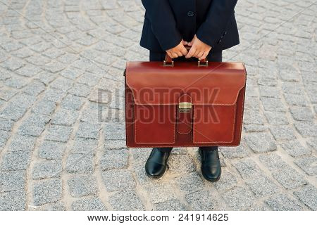 Future Businessman Holding, Close Up, Leather Briefcase While Staying On Pavage Street Outdoor In Ci