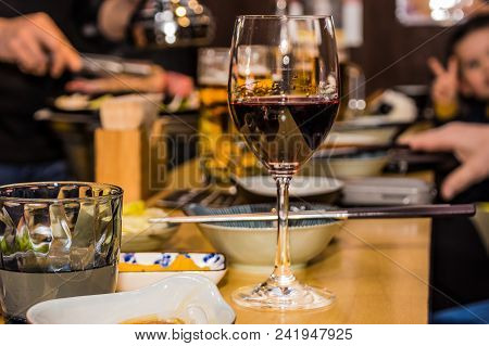 Glass With Red Wine In Japanese Restaurant