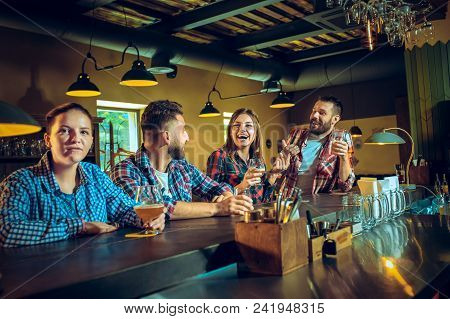 Sport, People, Leisure, Friendship, Entertainment Concept - Happy Male And Female Football Fans Or G