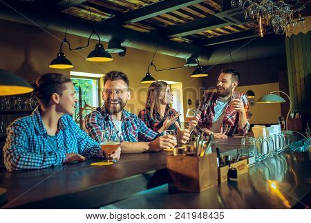 Sport, People, Leisure, Friendship, Entertainment Concept - Happy Male And Female Football Fans Or G