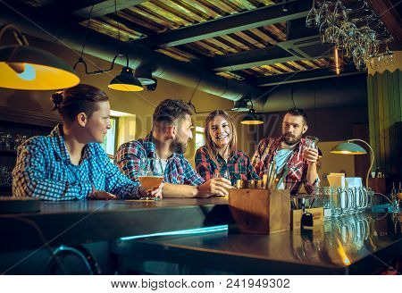 Sport, People, Leisure, Friendship, Entertainment Concept - Happy Male And Female Football Fans Or G