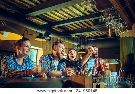 Sport, People, Leisure, Friendship, Entertainment Concept - Happy Male And Female Football Fans Or G