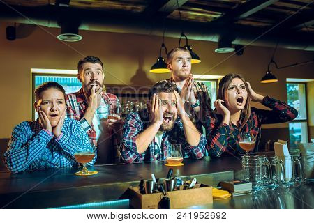 Sport, People, Leisure, Friendship, Entertainment Concept - Happy Male And Female Football Fans Or G