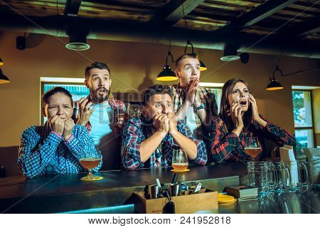 Sport, People, Leisure, Friendship, Entertainment Concept - Happy Male And Female Football Fans Or G