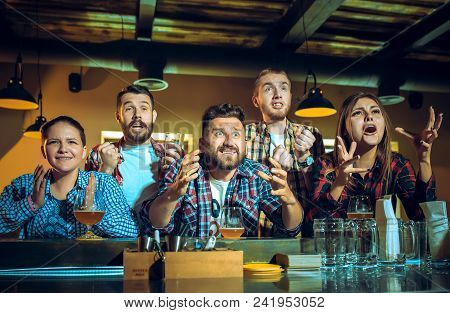 Sport, People, Leisure, Friendship, Entertainment Concept - Happy Male And Female Football Fans Or G