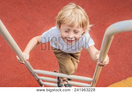 Funny Cute Happy Baby Playing On The Playground. The Emotion Of Happiness, Fun, Joy.