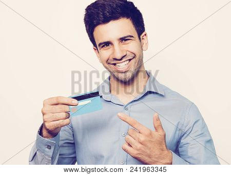 Successful Young Cardholder Using Convenient Service For Payment. Happy Businessman Holding Credit C