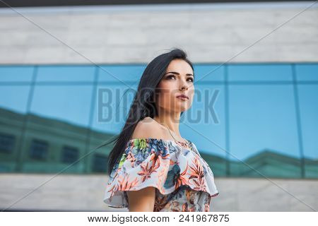 Portrait Of Young Thoughtfull Teen In The City, Looking Left. Concept Of Freedom Purposeful Teenager