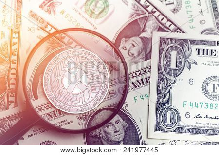 Shiny Golden Axt Cryptocurrency Coin On Blurry Background With Dollar Money Token 3d Illustration