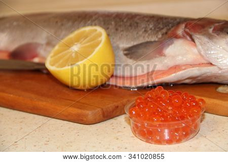 Rainbow Trout Fish Red Caviar And Lemon. Cooking Fish Dish With Lemon. Tasty Fish Dish. Cooking Red 