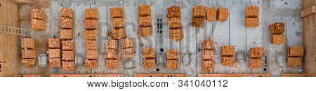 Pallets Of Clay Brick Stored For Building Construction. Construction Site Background. Top View, Ndus