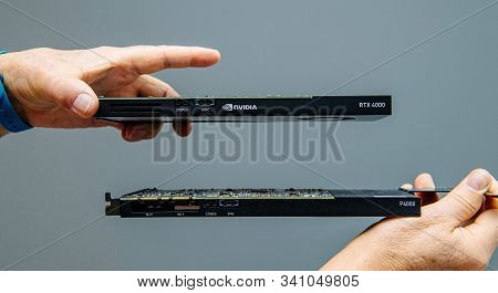 Paris, France - Mar 28, 2019: Man Hands Comparing Latest Nvidia Quadro Professional Gpu Video Card R