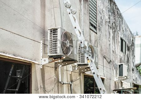 The Steel Ladder For Repair And Clean Air Conditioner Cleaning Outdoor.