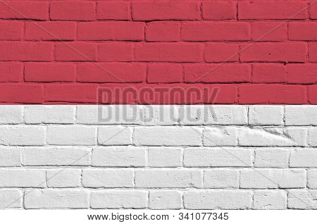 Indonesia Flag Depicted In Paint Colors On Old Brick Wall. Textured Banner On Big Brick Wall Masonry