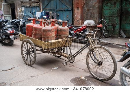 Delhi, India - December 14, 2019: Bicycle Cart With Propane Gas Tanks In Chandi Chowk Market In Old 