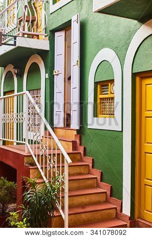 Panaji, India - December 16, 2019: Wall Of A House In Fontainhas Panjim Goa. Green Wall With A Door.