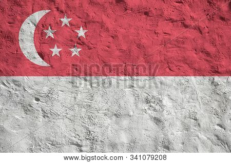 Singapore Flag Depicted In Bright Paint Colors On Old Relief Plastering Wall. Textured Banner On Rou