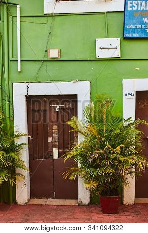 Panaji, India - December 15, 2019: A Narrow Lane Surrounded By Colorful Portuguese Houses In Panjim,