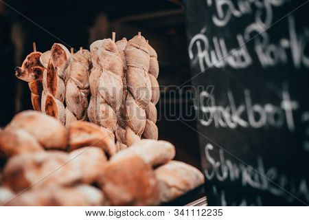 Bread On A Stick And Red Burger Buns Baked In A Wood Stove With Pulled Pork Chocolate Market Chocola
