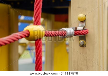 Red Rope Ladder For Children. Side Mounting The Stairs To The Beam. Children Playground. Selective F