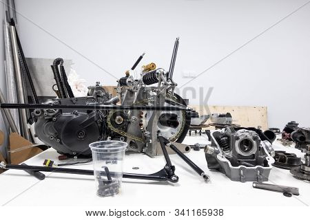 Sports Car Engine Parts On The Table. Assembling Of Vehicle Engine. Car Engine Parts. Assembly Of Mo