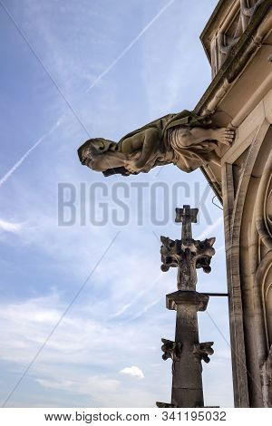 Ulm, Germany - July 20, 2019: Vertical View To The Grotesque Gargoyle At The Gothic Tower A Part Of 
