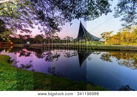 Different Shade Color Prince Mahidol Hall Building Of Mahidol University With Reflections Of The Sun