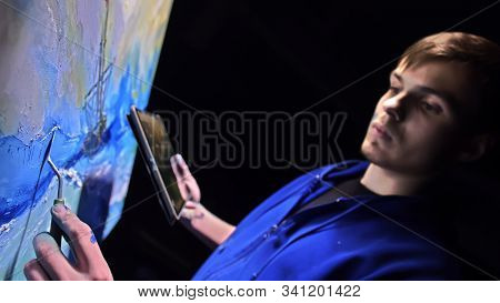 Artist Copyist Paint Seascape With Ship In Ocean. Craftsman Decorator Draw As Boat Sail On Blue Sea 