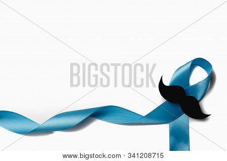 Light Blue Ribbon With Mustache On White Background. Prostate Cancer Awareness, Movember Men's Healt
