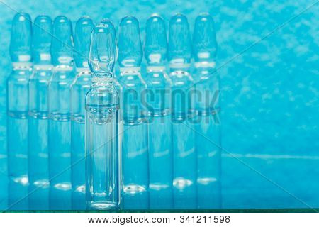 Glass Medical Ampoule Vial For Injection. Medicine Is Liquid Sodium Chloride With Of Aqueous Solutio