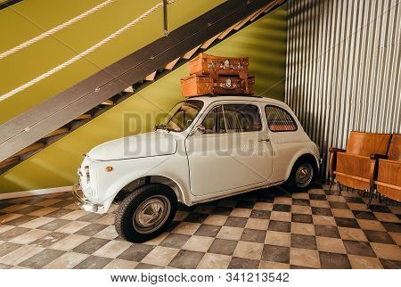 Catania, Italy: Small White Retro Car With Travel Bags On A Trunk Space Ready For Moving From Garage