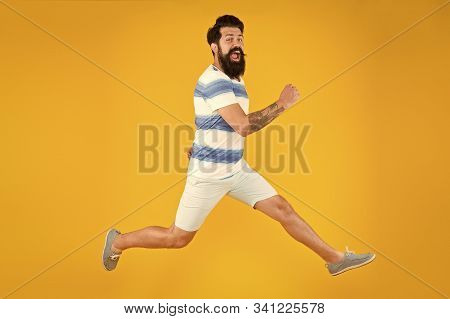 Hurry Up. Summer Vacation. Man Bearded Hipster With Mustache Long Beard Running Yellow Background. G