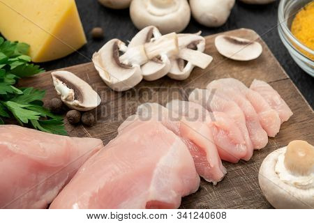 Slicing Chicken Breast Fillet For Cooking With Champignons And Cheese